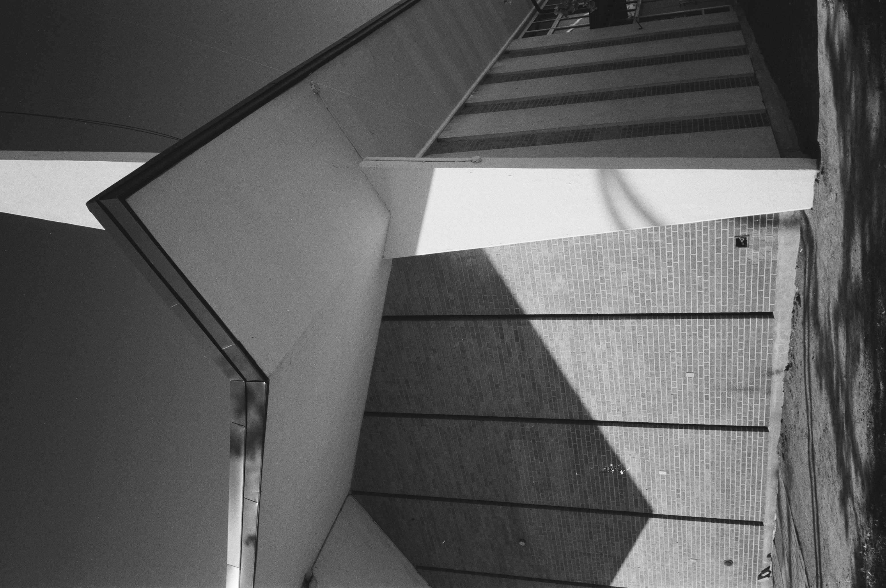 A black & white photograph of a mid-century modern style building